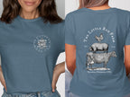 Blue t-shirt with "The Little Red Farm" logo and farm animals on back.