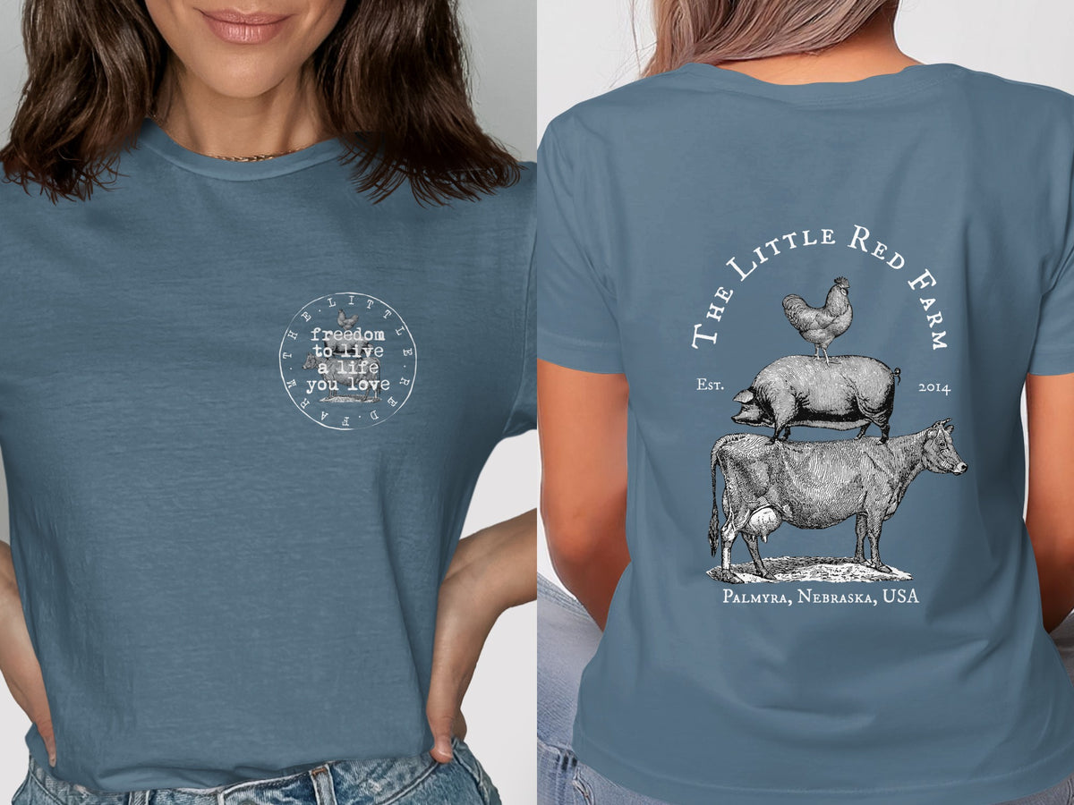 Blue t-shirt with "The Little Red Farm" logo and farm animals on back.