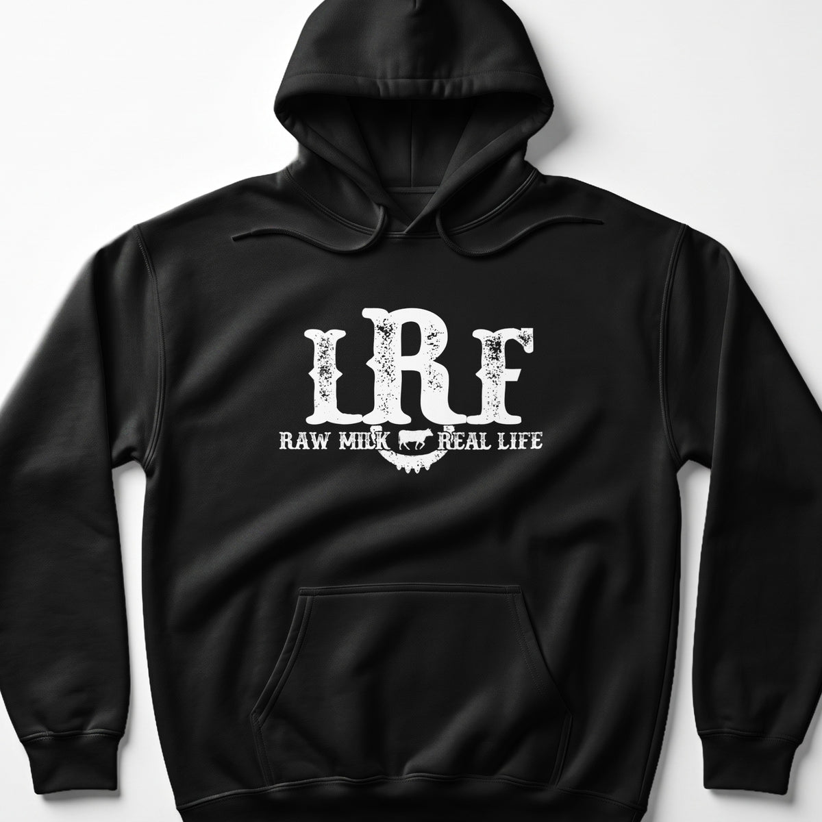 Black hoodie with white distressed text "LRF RAW MILK REAL LIFE" and a cow graphic.