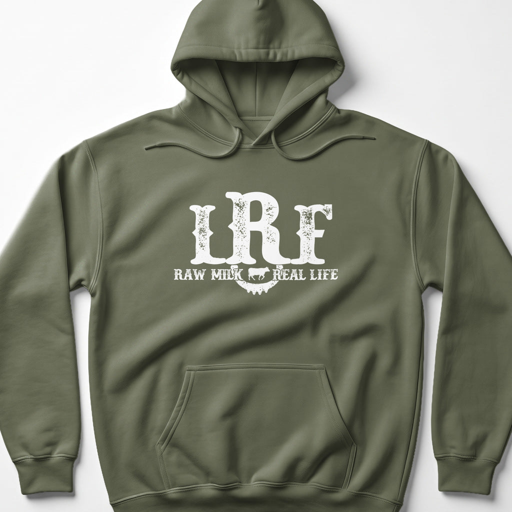 An olive green hooded sweatshirt with white distressed text reading Raw Milk Real Life and the letters LRF centered on the chest.