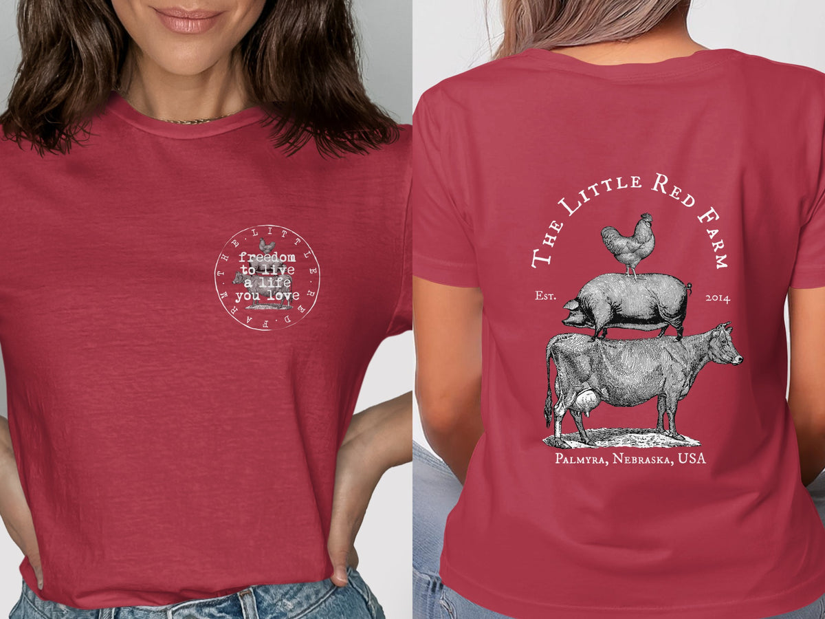 Red t-shirt with "freedom to live a life you love" on front and farm animals on back.