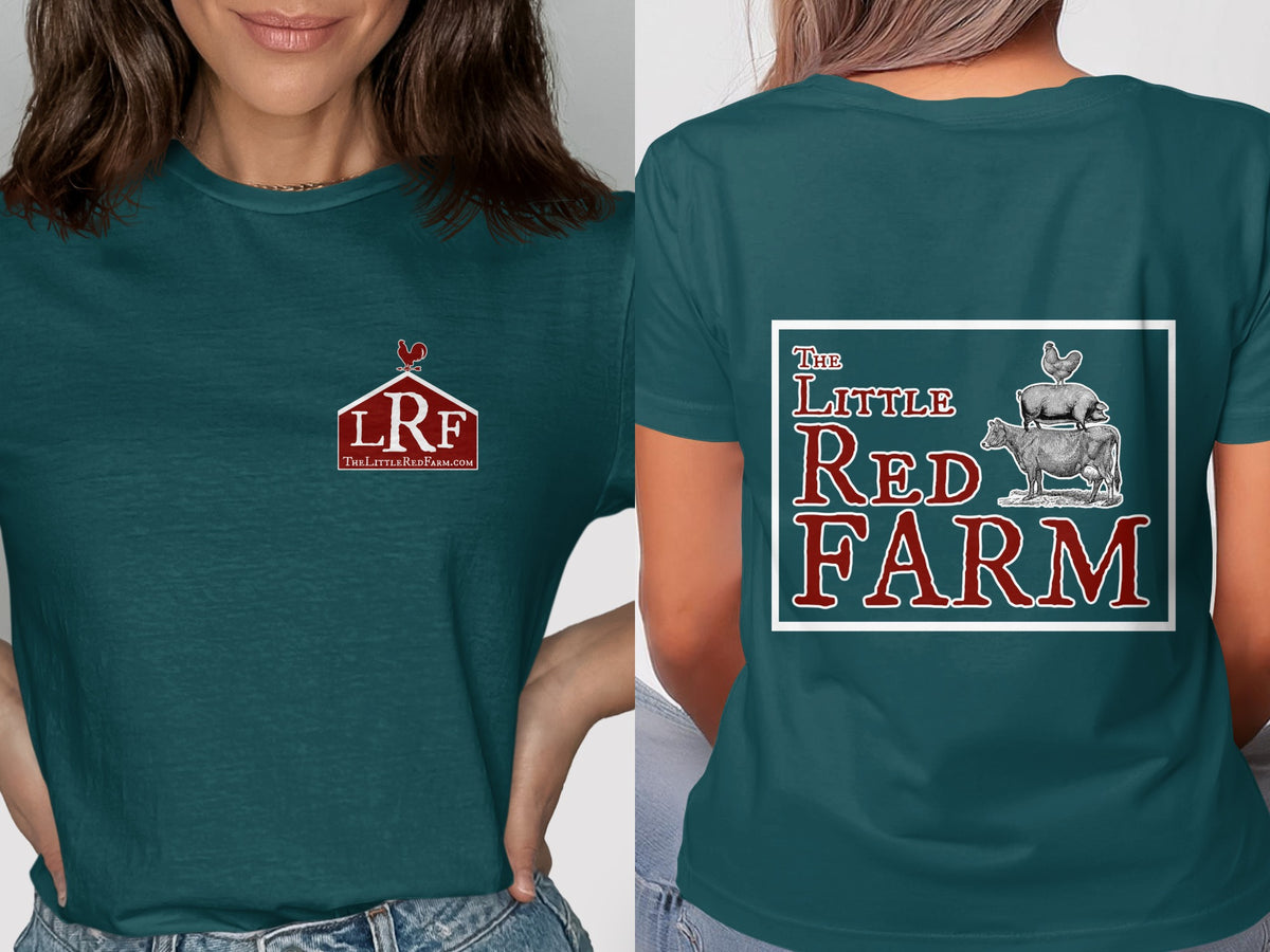 A woman wearing a dark teal t-shirt with a small barn logo on the front and farm animals stacked on the back.