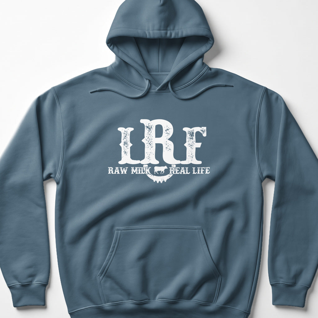 Blue hoodie with white "IRF RAW MILK REAL LIFE" text and cow graphic.