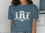 Blue t-shirt with "LRF RAW MILK REAL LIFE" text and a cow silhouette.