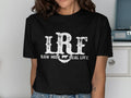 Black t-shirt with white text "IRF" and "RAW MILK REAL LIFE" and cow graphic.